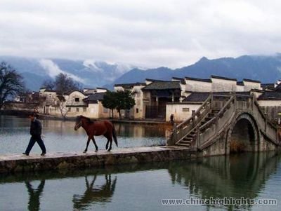 Hongcun Village is surrounded by a picturesque moat with bridges and a half-moon shaped pond in the centre.