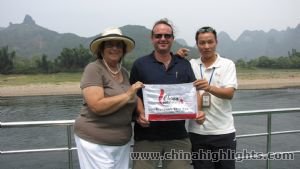 Our guests and tour guide holding CHT flag.