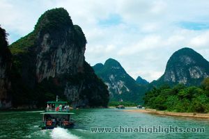 Relax on the famous Li River Cruise while the picturesque Karst Landscape passes by